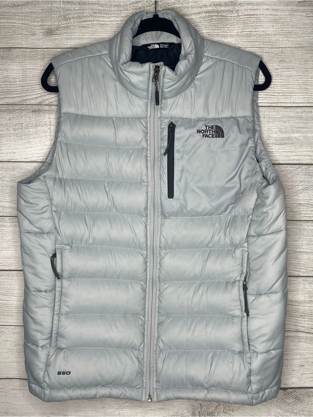 The North Face Light Gray Puffer Jacket with Black Zip Trim